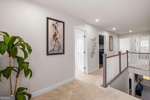 1049 Climbing Rose Way, Mcdonough, GA 30253 - hallway featuring an upstairs landing, carpet floors, baseboards, and recessed lighting