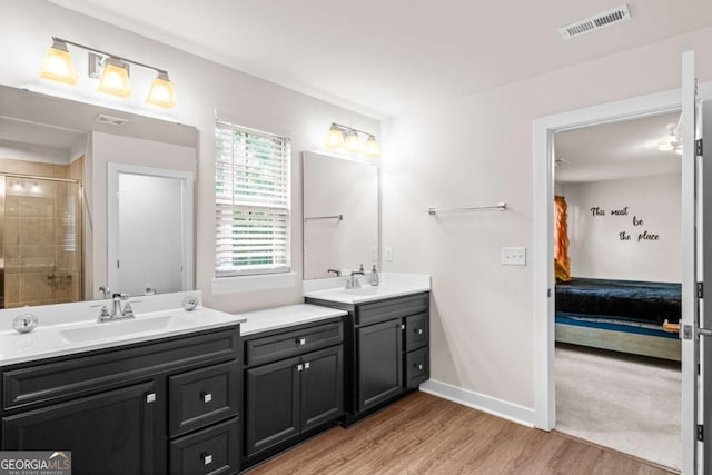 1049 Climbing Rose Way, Mcdonough, GA 30253 - full bath featuring ensuite bathroom, vanity, wood finished floors, a tile shower, and baseboards