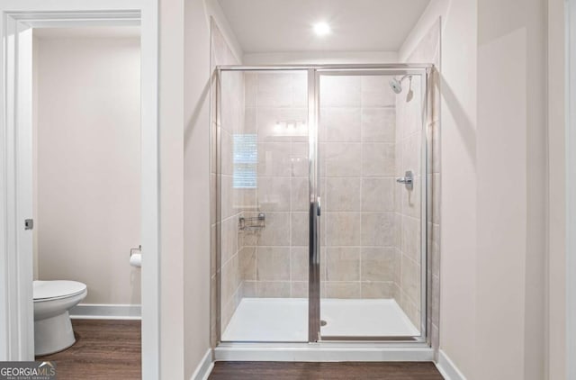 1049 Climbing Rose Way, Mcdonough, GA 30253 - full bathroom with toilet, a shower stall, wood finished floors, baseboards, and recessed lighting