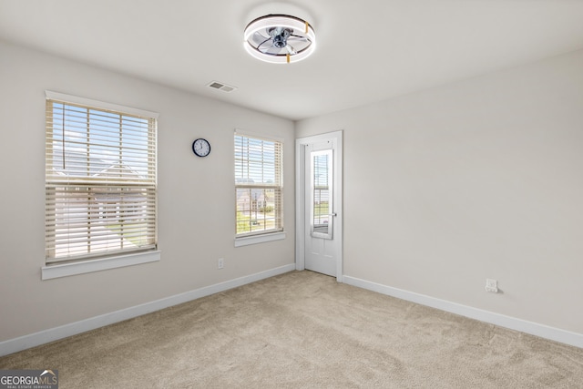 1049 Climbing Rose Way, Mcdonough, GA 30253 - carpeted spare room with baseboards and a ceiling fan