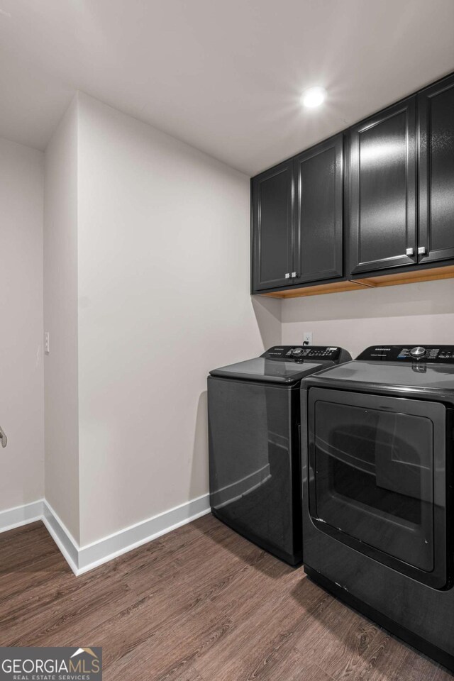 1049 Climbing Rose Way, Mcdonough, GA 30253 - laundry area featuring separate washer and dryer, cabinet space, dark wood-style flooring, and recessed lighting
