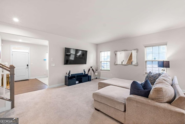 1049 Climbing Rose Way, Mcdonough, GA 30253 - living area featuring carpet flooring, baseboards, stairway, and recessed lighting