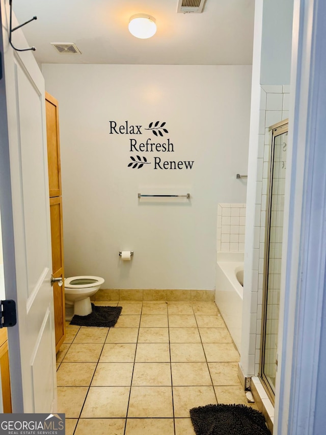 870 Mayson Turner Rd Unit 1207, Atlanta, GA 30314 - full bathroom with tile patterned flooring, a garden tub, toilet, and a shower stall
