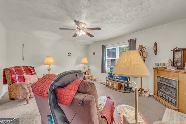 3131 Langley Rd, Loganville, GA 30052 - living area with carpet flooring, a fireplace, a ceiling fan, and a textured ceiling