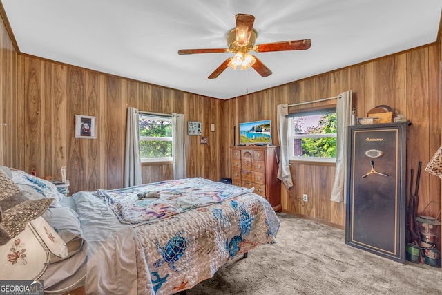 3131 Langley Rd, Loganville, GA 30052 - bedroom featuring wooden walls, light carpet, and a ceiling fan