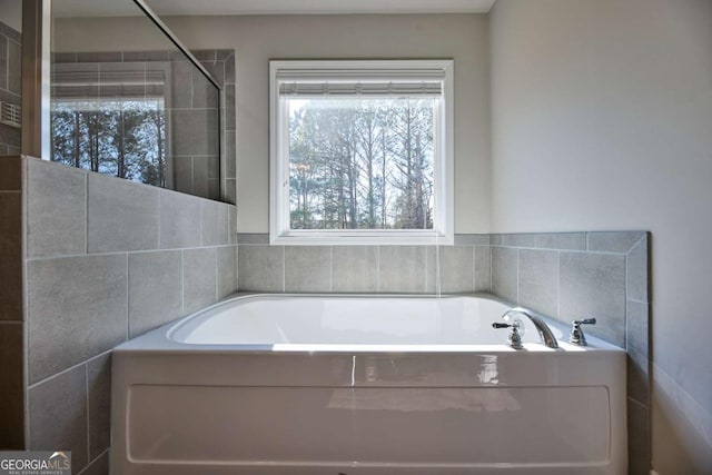 3557 Bryant Meadows Cir, Buford, GA 30519 - bathroom with a bath, healthy amount of natural light, and a tile shower