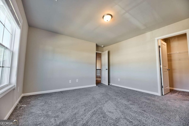 3557 Bryant Meadows Cir, Buford, GA 30519 - unfurnished bedroom featuring carpet flooring and baseboards
