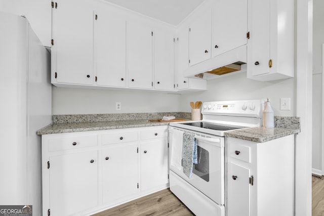 234 Edgewood Dr, Mount Airy, GA 30563 - kitchen featuring white appliances, premium range hood, light wood-style flooring, and white cabinets