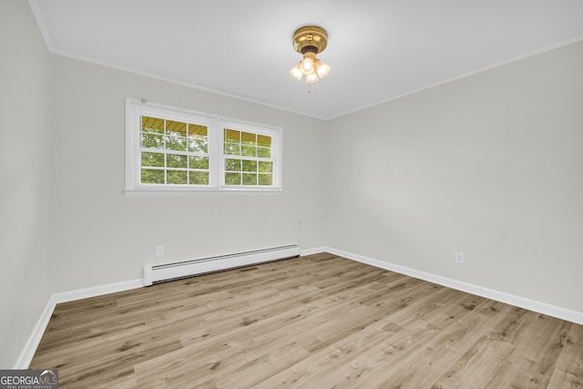 234 Edgewood Dr, Mount Airy, GA 30563 - spare room featuring a baseboard heating unit, ornamental molding, wood finished floors, and baseboards