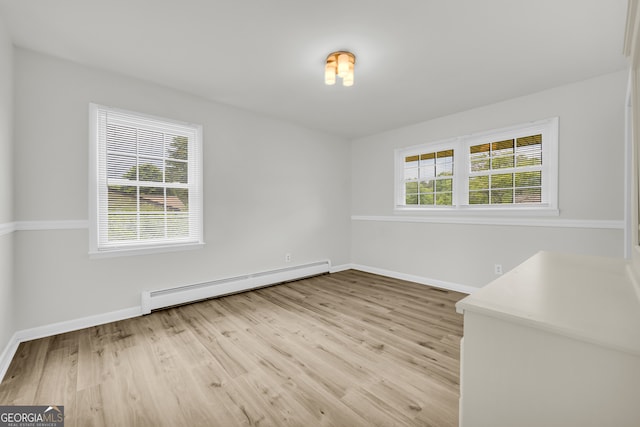 234 Edgewood Dr, Mount Airy, GA 30563 - spare room with a baseboard radiator, baseboards, and light wood-type flooring