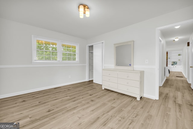 234 Edgewood Dr, Mount Airy, GA 30563 - unfurnished bedroom with light wood-type flooring, baseboards, and a closet
