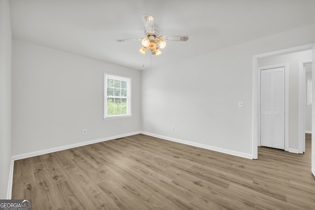 234 Edgewood Dr, Mount Airy, GA 30563 - empty room with wood finished floors, baseboards, and a ceiling fan