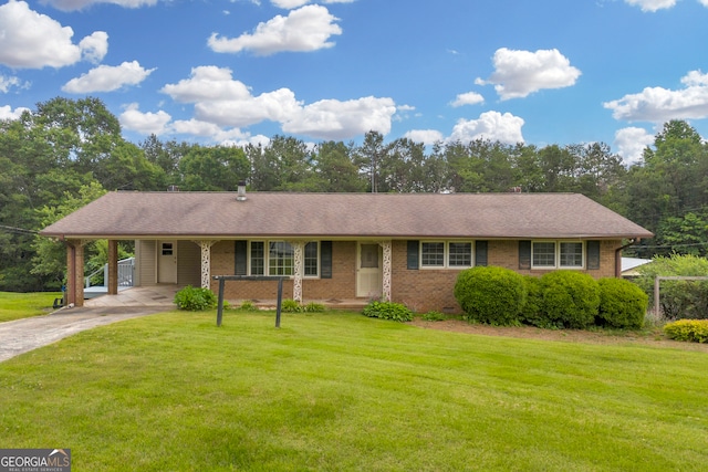 234 Edgewood Dr, Mount Airy, GA 30563 - ranch-style house with brick siding, a front yard, driveway, and an attached carport