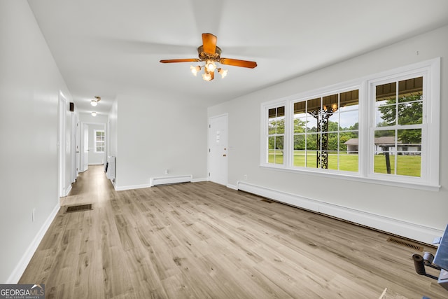 234 Edgewood Dr, Mount Airy, GA 30563 - foyer with baseboard heating, light wood finished floors, and plenty of natural light