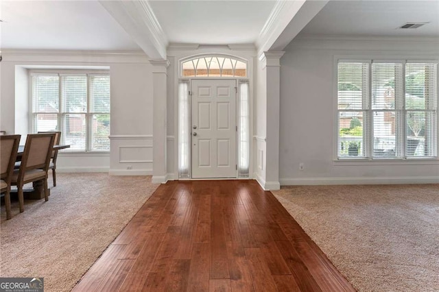 1055 Beacon Hill Xing, Alpharetta, GA 30005 - foyer with decorative columns, crown molding, healthy amount of natural light, and wood-type flooring