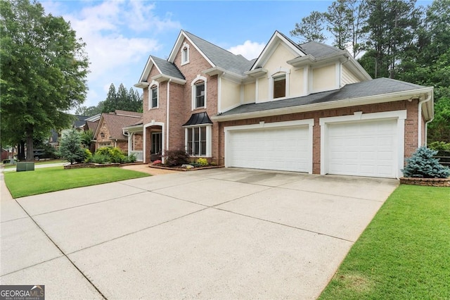 1055 Beacon Hill Xing, Alpharetta, GA 30005 - view of front of home featuring driveway, a front lawn, brick siding, a shingled roof, and a garage