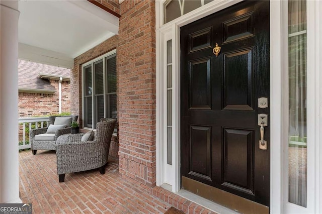 1055 Beacon Hill Xing, Alpharetta, GA 30005 - view of exterior entry featuring covered porch and brick siding