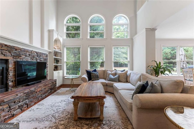 1055 Beacon Hill Xing, Alpharetta, GA 30005 - living area with a towering ceiling, built in features, and a fireplace