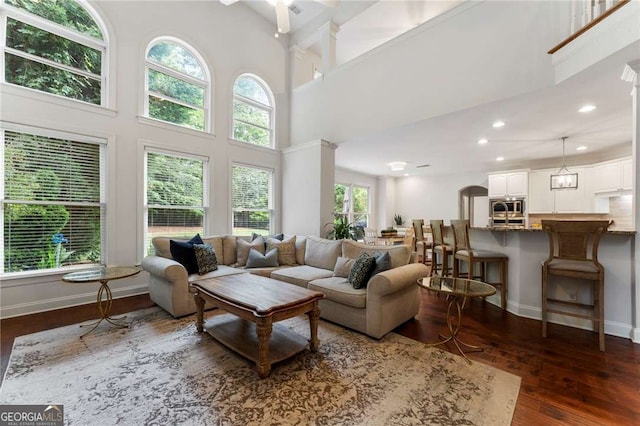 1055 Beacon Hill Xing, Alpharetta, GA 30005 - living room with dark wood-style floors, a high ceiling, baseboards, and recessed lighting