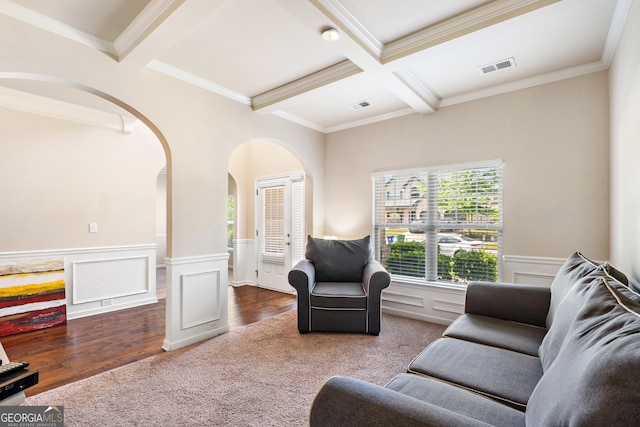 7946 White Oak Loop, Stonecrest, GA 30038 - living area featuring arched walkways, beam ceiling, ornamental molding, wainscoting, and coffered ceiling