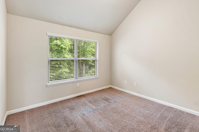 7946 White Oak Loop, Stonecrest, GA 30038 - carpeted empty room featuring lofted ceiling and baseboards
