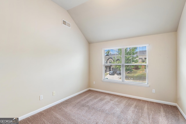 7946 White Oak Loop, Stonecrest, GA 30038 - carpeted empty room featuring vaulted ceiling and baseboards