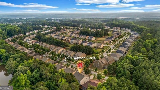 7601 Watson Cir, Locust Grove, GA 30248 - aerial overview of property's location featuring nearby suburban area and a heavily wooded area