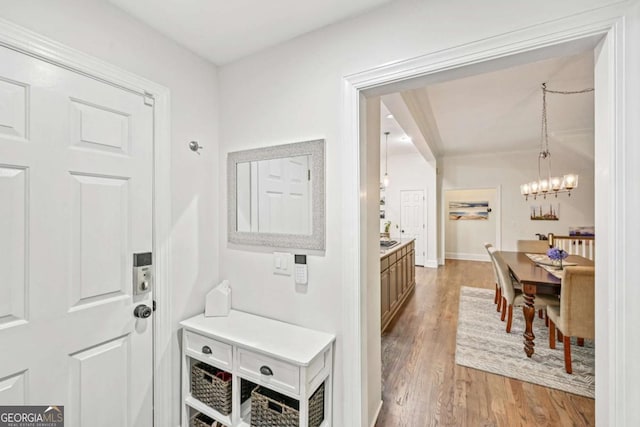 81 Cane Mill Ln, Dahlonega, GA 30533 - mudroom featuring light wood-style floors and a chandelier