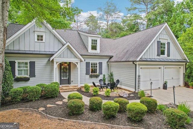 81 Cane Mill Ln, Dahlonega, GA 30533 - view of front of property with a shingled roof, concrete driveway, board and batten siding, and a garage