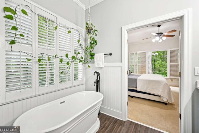 81 Cane Mill Ln, Dahlonega, GA 30533 - ensuite bathroom with a soaking tub, ceiling fan, wood finished floors, wainscoting, and ornamental molding