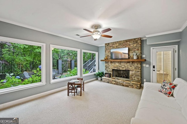 81 Cane Mill Ln, Dahlonega, GA 30533 - carpeted living room featuring crown molding, a ceiling fan, and a stone fireplace