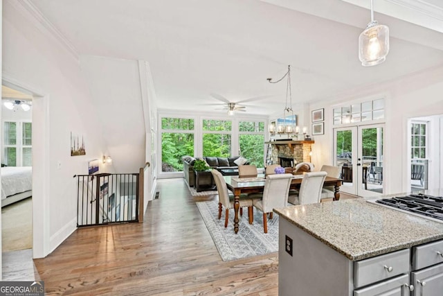 81 Cane Mill Ln, Dahlonega, GA 30533 - kitchen with a ceiling fan, open floor plan, gray cabinets, plenty of natural light, and crown molding