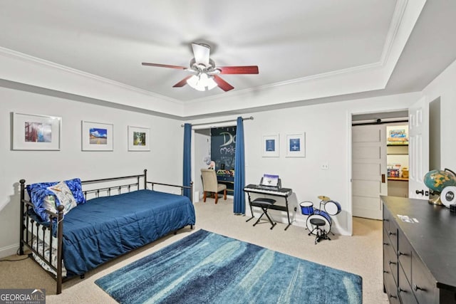 81 Cane Mill Ln, Dahlonega, GA 30533 - bedroom with carpet, a barn door, a tray ceiling, ornamental molding, and ceiling fan