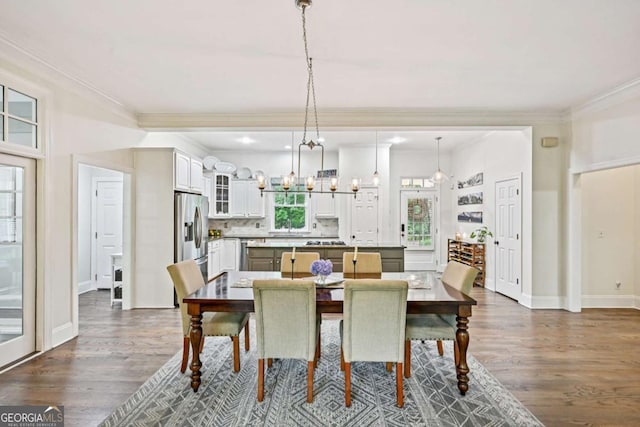 81 Cane Mill Ln, Dahlonega, GA 30533 - dining room featuring crown molding, dark wood-style floors, and a chandelier