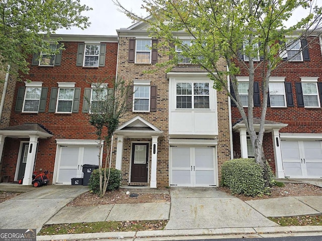 2104 Meadow Peak Rd, Duluth, GA 30097 - view of property with a garage, brick siding, and driveway