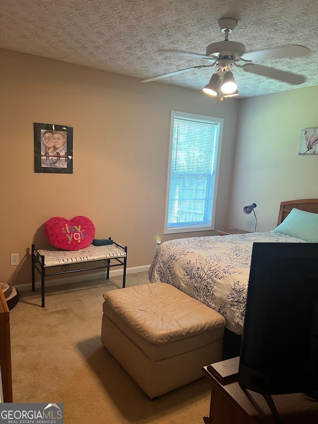 740 Pebble Blvd, Covington, GA 30016 - bedroom featuring a textured ceiling, light carpet, baseboards, and a ceiling fan