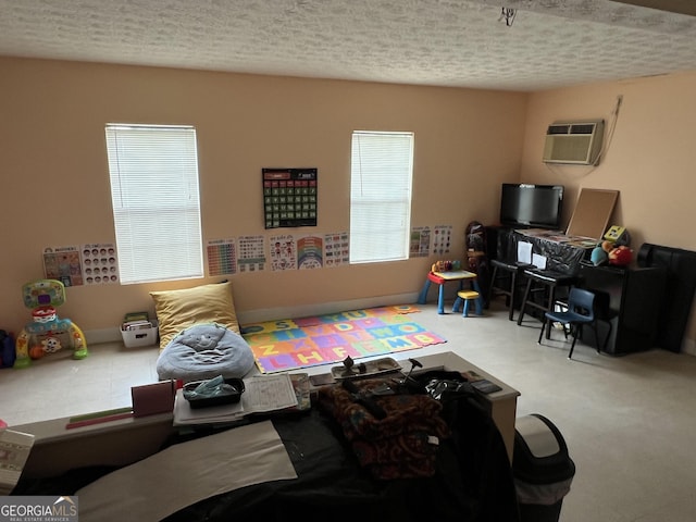 740 Pebble Blvd, Covington, GA 30016 - living area with an AC wall unit and a textured ceiling