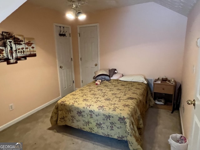 740 Pebble Blvd, Covington, GA 30016 - bedroom with carpet flooring, baseboards, and lofted ceiling