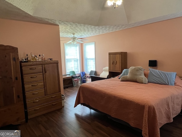740 Pebble Blvd, Covington, GA 30016 - bedroom featuring dark wood-style flooring, vaulted ceiling, and a ceiling fan
