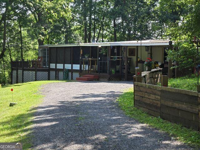 81 Shrader Ln, Ringgold, GA 30736 - view of front facade with a wooden deck and view of scattered trees