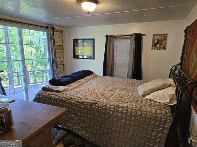 81 Shrader Ln, Ringgold, GA 30736 - bedroom featuring a textured ceiling and ornamental molding