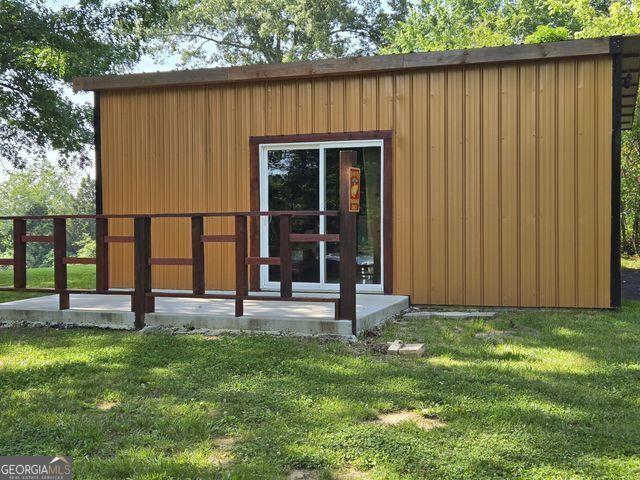 81 Shrader Ln, Ringgold, GA 30736 - back of house featuring a yard and an outbuilding