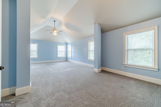 1022 Nestling Dr, Lawrenceville, GA 30045 - empty room featuring a ceiling fan, carpet, lofted ceiling, and baseboards