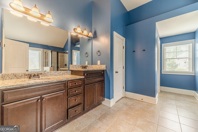 1022 Nestling Dr, Lawrenceville, GA 30045 - bathroom with a stall shower, double vanity, baseboards, and tile patterned floors