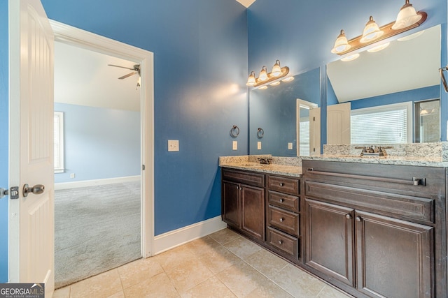 1022 Nestling Dr, Lawrenceville, GA 30045 - full bath featuring double vanity, baseboards, a ceiling fan, tile patterned floors, and vaulted ceiling