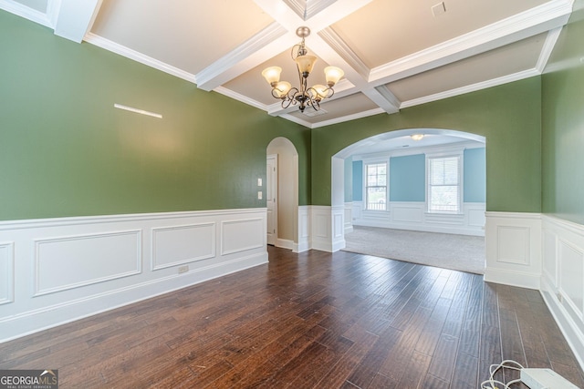 1022 Nestling Dr, Lawrenceville, GA 30045 - empty room featuring arched walkways, a chandelier, beam ceiling, coffered ceiling, and dark wood-style flooring