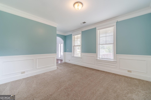 1022 Nestling Dr, Lawrenceville, GA 30045 - carpeted empty room featuring wainscoting, crown molding, and arched walkways