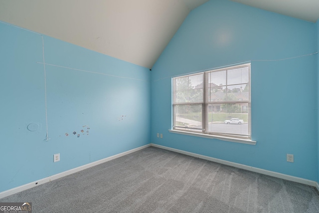 1022 Nestling Dr, Lawrenceville, GA 30045 - spare room with lofted ceiling, carpet floors, and baseboards
