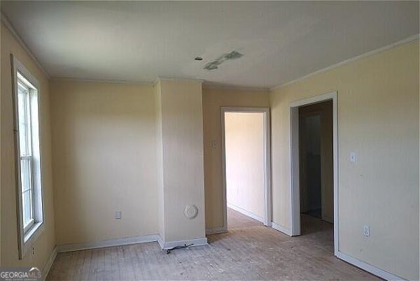 533 Hodges Mill Rd, Hartwell, GA 30643 - spare room featuring healthy amount of natural light, ornamental molding, and baseboards
