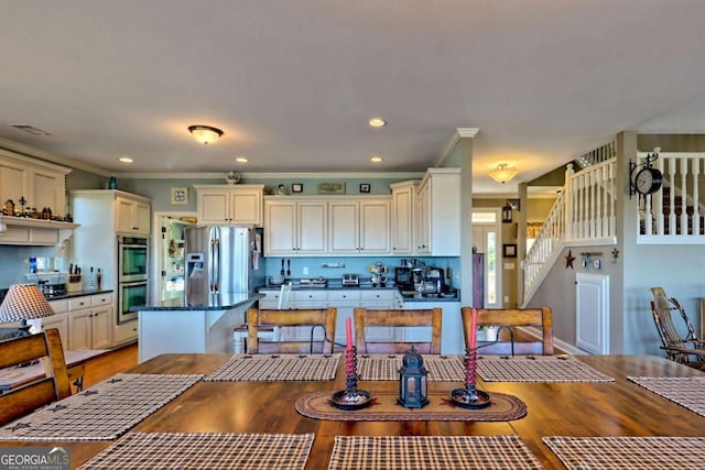 296 Tallulah Vw, Tallulah Falls, GA 30573 - kitchen featuring appliances with stainless steel finishes, light wood-style flooring, crown molding, and recessed lighting